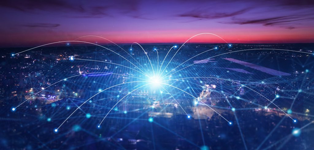 a network expanding over a city scape